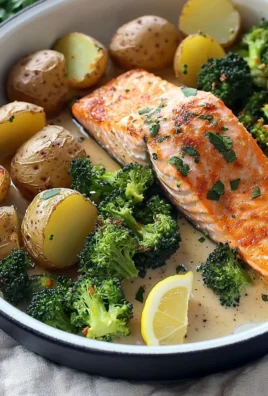 Baked salmon with crispy potatoes and broccoli on a plate