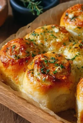 Buttery cheese garlic rolls fresh out of the oven, golden and delicious