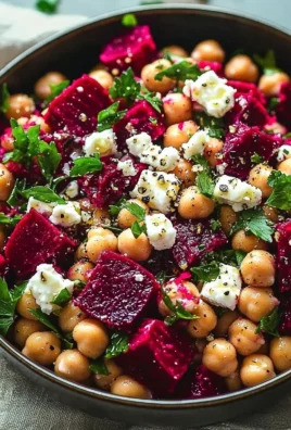 Chickpea, Beet, and Feta Salad served in a bowl with colorful ingredients