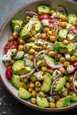 Chickpea salad with feta cheese and avocado in a bowl