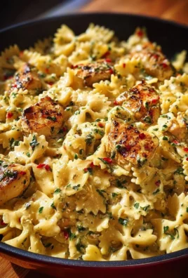 Creamy Chicken Bowtie Pasta dish garnished with herbs