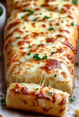 Plate of easy cheesy garlic bread with melted cheese and garlic garnish