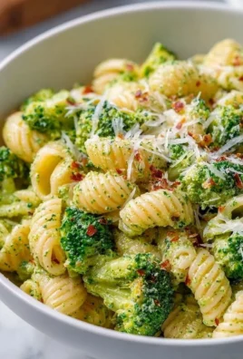 Delicious and healthy broccoli pasta dish garnished with fresh herbs