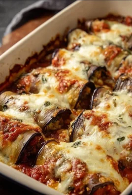 Fluffy Eggplant Rollatini Bake served on a plate with fresh basil.