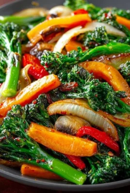 Colorful sautéed vegetables in a skillet, showcasing a healthy and flavorful side dish.