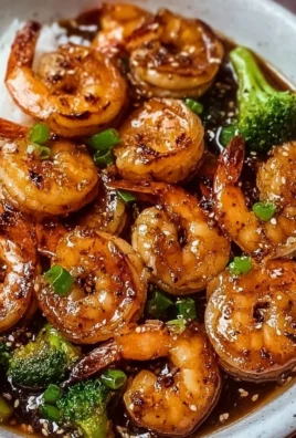 High-Protein Honey Garlic Shrimp served on a plate with vegetables