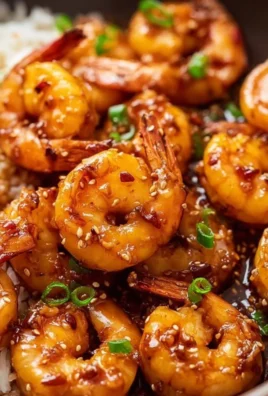 Plate of Honey Garlic Shrimp with fresh herbs and rice