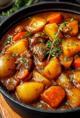 Bowl of Irish vegetarian stew with fresh vegetables and herbs