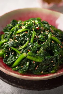Delicious Korean spinach side dish Sigeumchi Namul served in a bowl