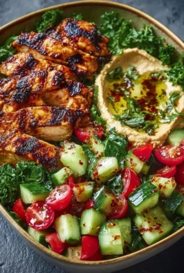 Lemon Chili Grilled Chicken Bowls with cucumber salad and hummus.