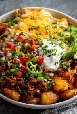 Delicious Loaded Potato Taco Bowl with toppings in a serving bowl