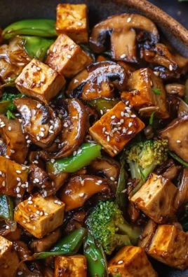 Delicious Mushroom Tofu Stir-Fry served in a colorful bowl with fresh vegetables.