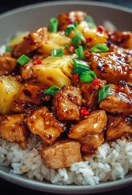 Delicious Pineapple Chicken served with fluffy rice and colorful vegetables