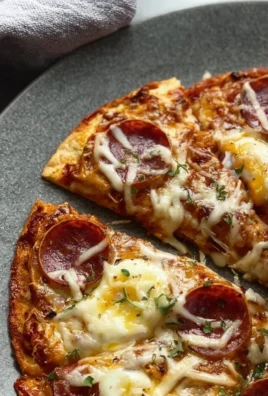 Delicious plate of Pizza Eggs with fresh toppings and melted cheese