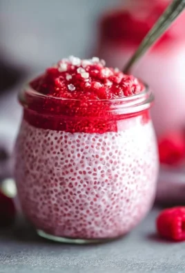 Raspberry Chia Pudding sweetened with maple syrup in a glass bowl