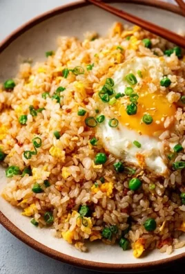 Savory Japanese garlic fried rice served in a bowl, perfect for cozy nights in.