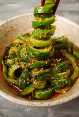 Spiral cucumber salad with Korean flavors, vibrant and healthy side dish.