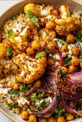 Cauliflower Shawarma Bowl served on a sheet pan with colorful vegetables