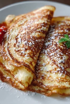 High-protein cottage cheese crepes served with fresh fruits and syrup