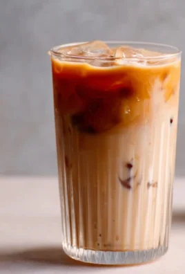 Delicious Iced Spanish Latte served in a glass with ice and cinnamon