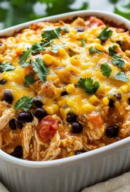 Delicious Mexican Chicken Casserole topped with cheese and herbs