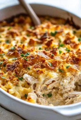 Delicious Million Dollar Chicken Casserole with cheesy topping and chicken