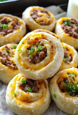 Freshly baked savory breakfast rolls on a wooden table