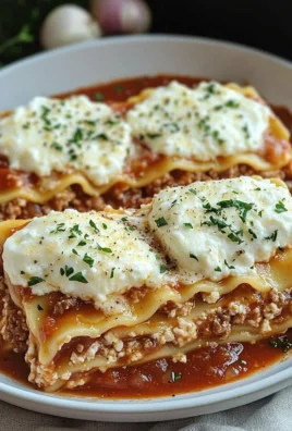 Delicious slow cooker lasagna layered with cheese and sauce in a slow cooker.
