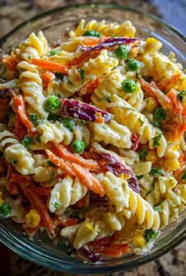 Delicious Crack Pasta Salad served in a bowl, garnished with fresh herbs.