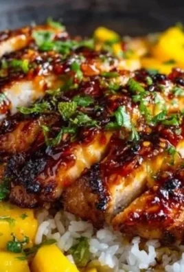 Asian Mango Glazed Chicken Twists served on a plate with garnishes