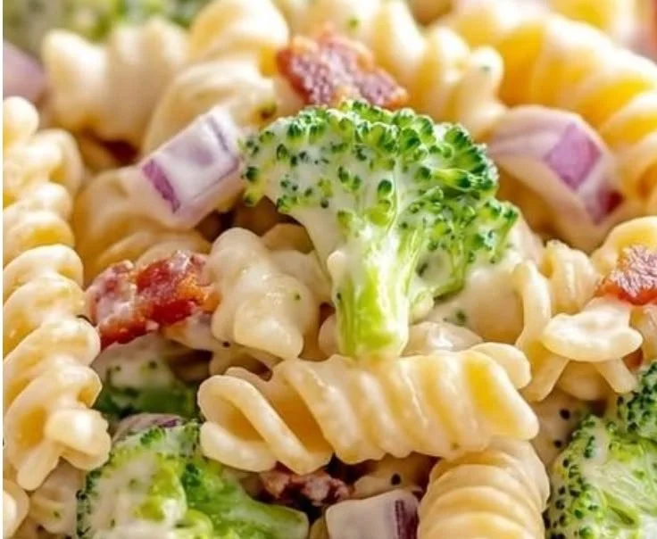 Delicious broccoli pasta salad with fresh vegetables and dressing