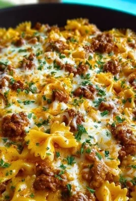 Cajun Cream Cheese Alfredo Bowties topped with spiced ground beef.