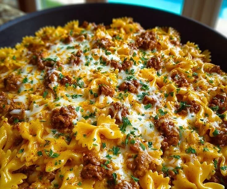 Cajun Cream Cheese Alfredo Bowties topped with spiced ground beef.