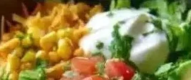 Delicious Chicken Enchilada Bowl topped with fresh ingredients and spices.