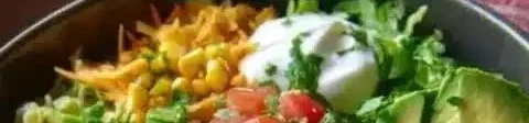 Delicious Chicken Enchilada Bowl topped with fresh ingredients and spices.