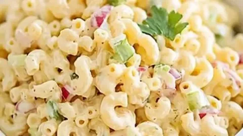 Delicious classic macaroni salad served in a bowl, perfect for summer picnics
