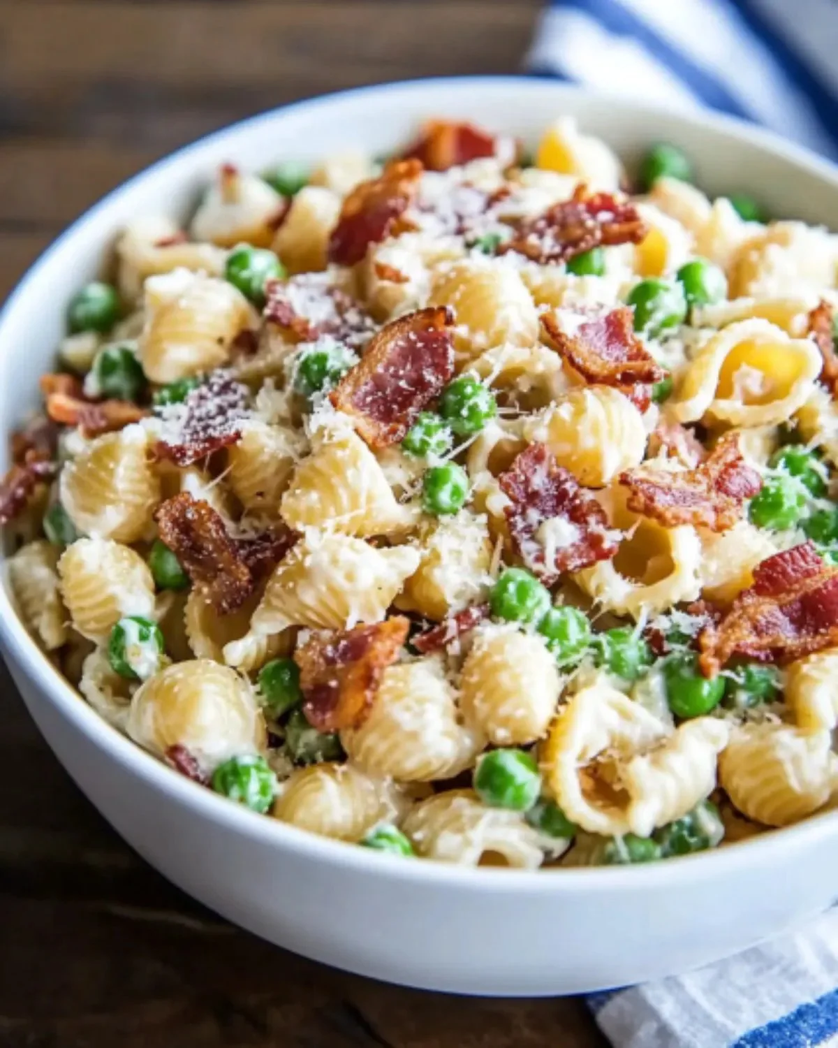 Creamy pasta salad served in a bowl with colorful vegetables and dressing