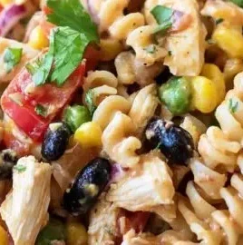 Colorful Southwest Chicken Pasta Salad with vegetables and dressing