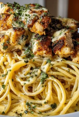 Bowl of creamy Cajun chicken spaghetti with garlic mozzarella sauce