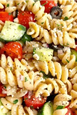 Bowl of easy Italian pasta salad with vegetables and dressing