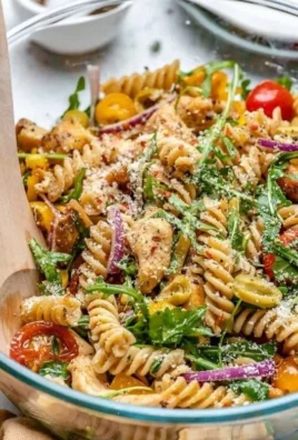 Delicious and colorful family favorite chicken pasta salad in a bowl