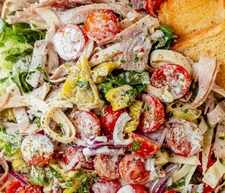 Delicious and colorful Grinder Salad with fresh vegetables and toppings.
