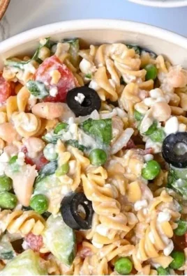 High-protein pasta salad with vegetables and dressing