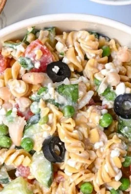 High protein pasta salad with fresh vegetables and protein-rich ingredients