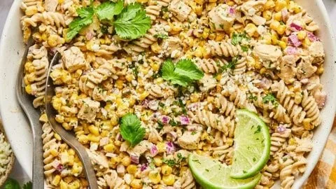 High protein street corn pasta salad with colorful vegetables and creamy dressing