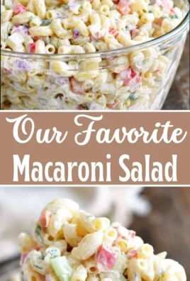 Delicious macaroni salad in a bowl with colorful vegetables and dressing.
