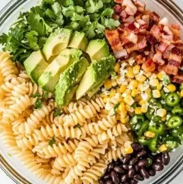 Mexican street corn pasta salad in a bowl topped with fresh cilantro