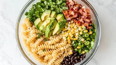 Mexican street corn pasta salad in a bowl topped with fresh cilantro