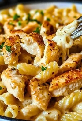 One Pot Garlic Parmesan Chicken Pasta served in a bowl with herbs