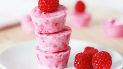 Delicious raspberry frozen yogurt bites served in a bowl with fresh raspberries